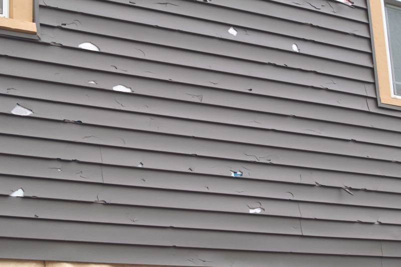 Damaged Vinyl Siding Panel